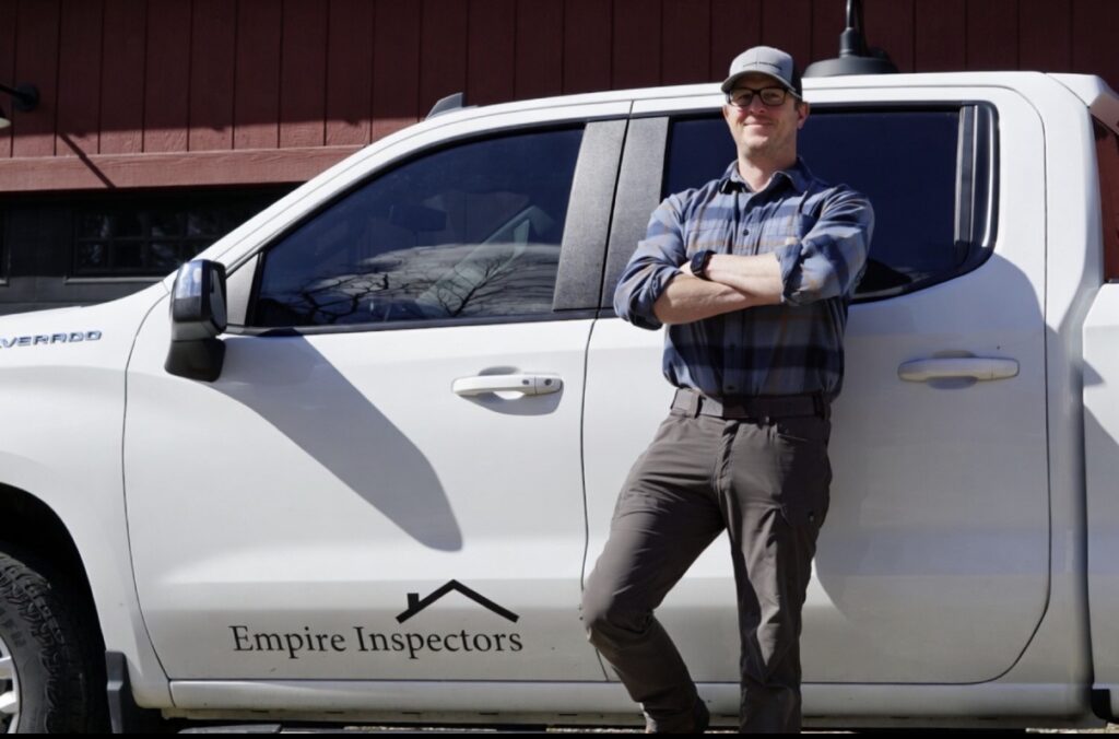 Inspector in front of a pickup