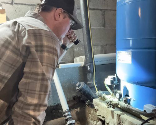 Inspector checking gauges